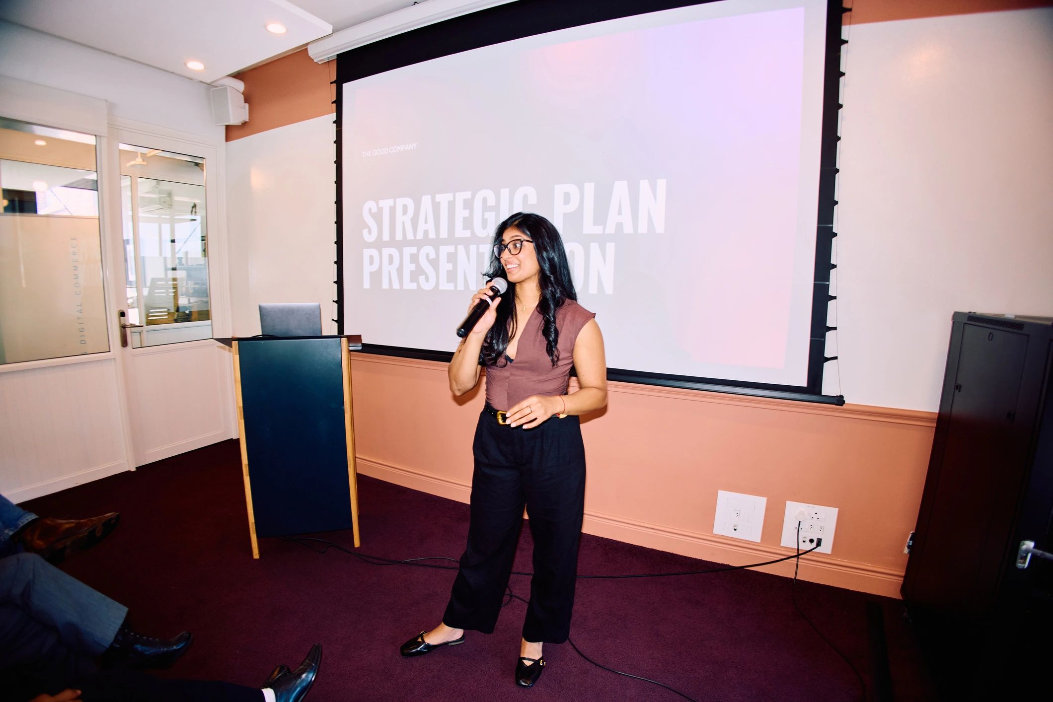 Businesswoman delivering an inspiring keynote presentation on stage
