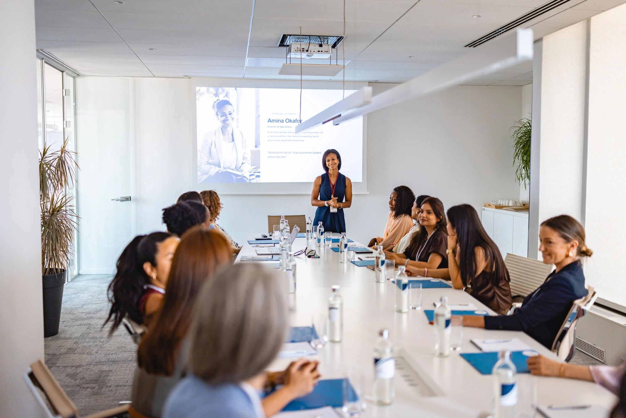 Speaker presenting to an engaged group at a conference